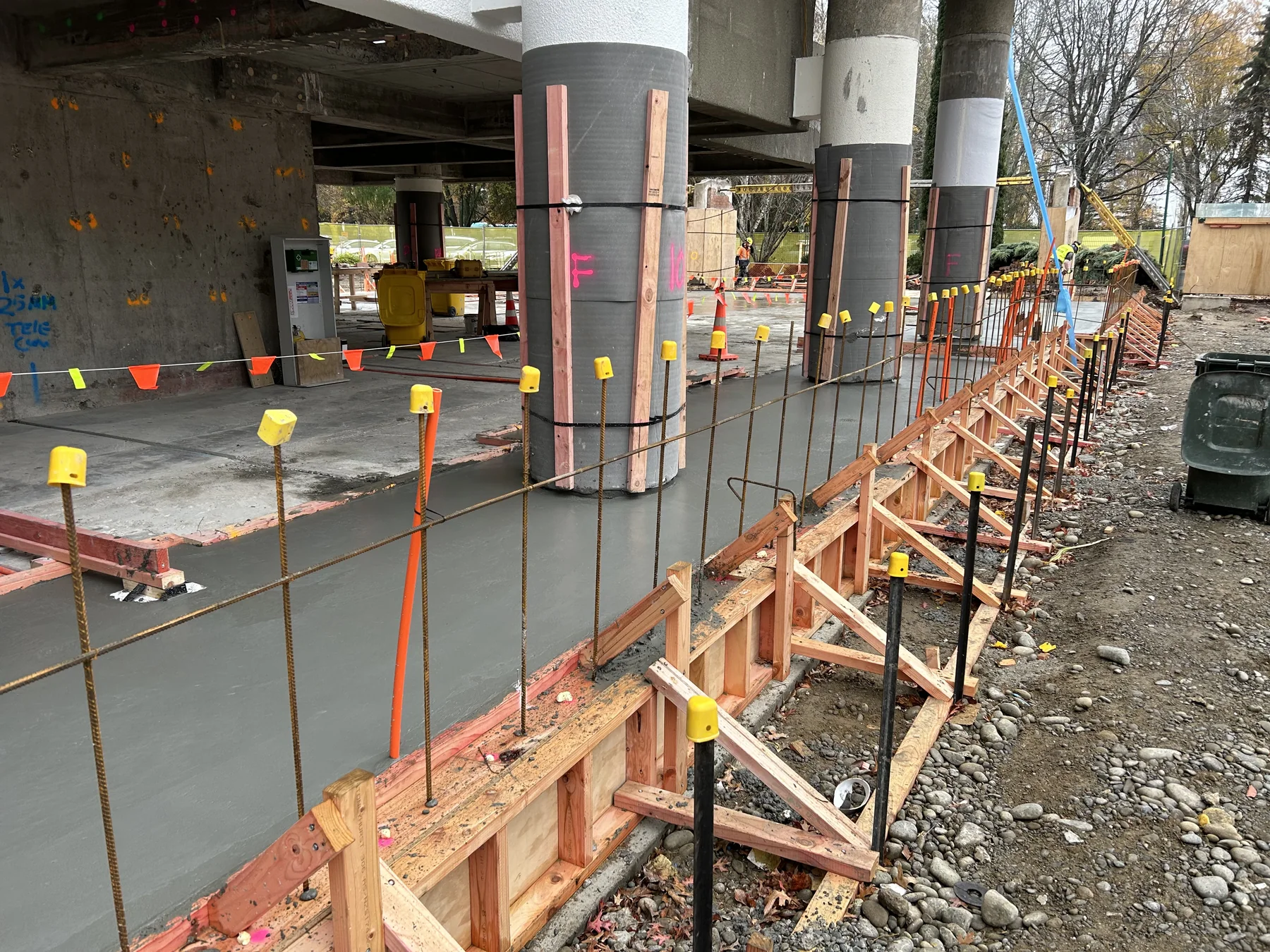 Concrete being placed beside the George Forbes Building