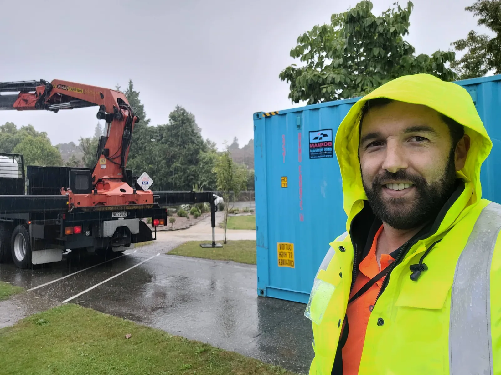 Josh Bohan coordinating a delivery to a South Island school during heavy rain