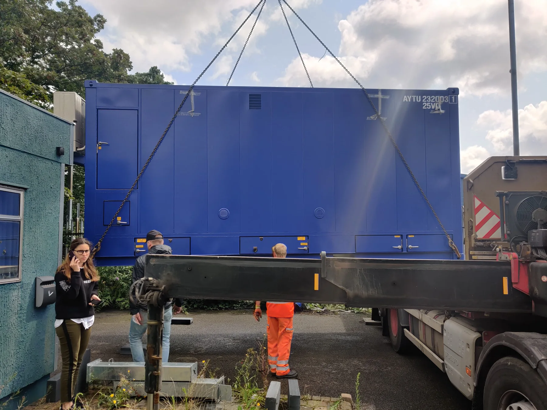 Crane lifting a modular REEF kitchen from a delivery vehicle