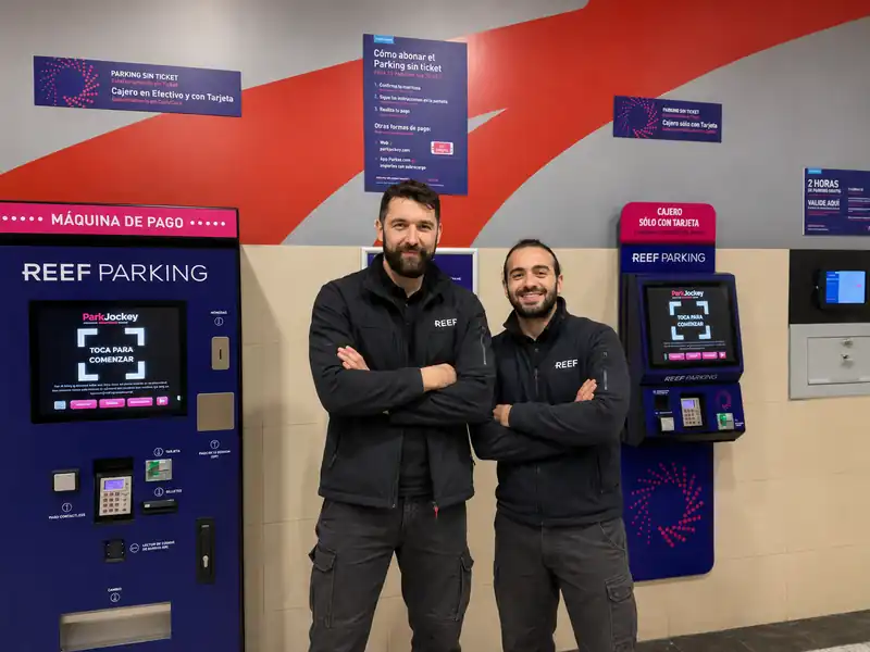 Project team beside live REEF Parking payment kiosks at the Zubiarte deployment in Bilbao